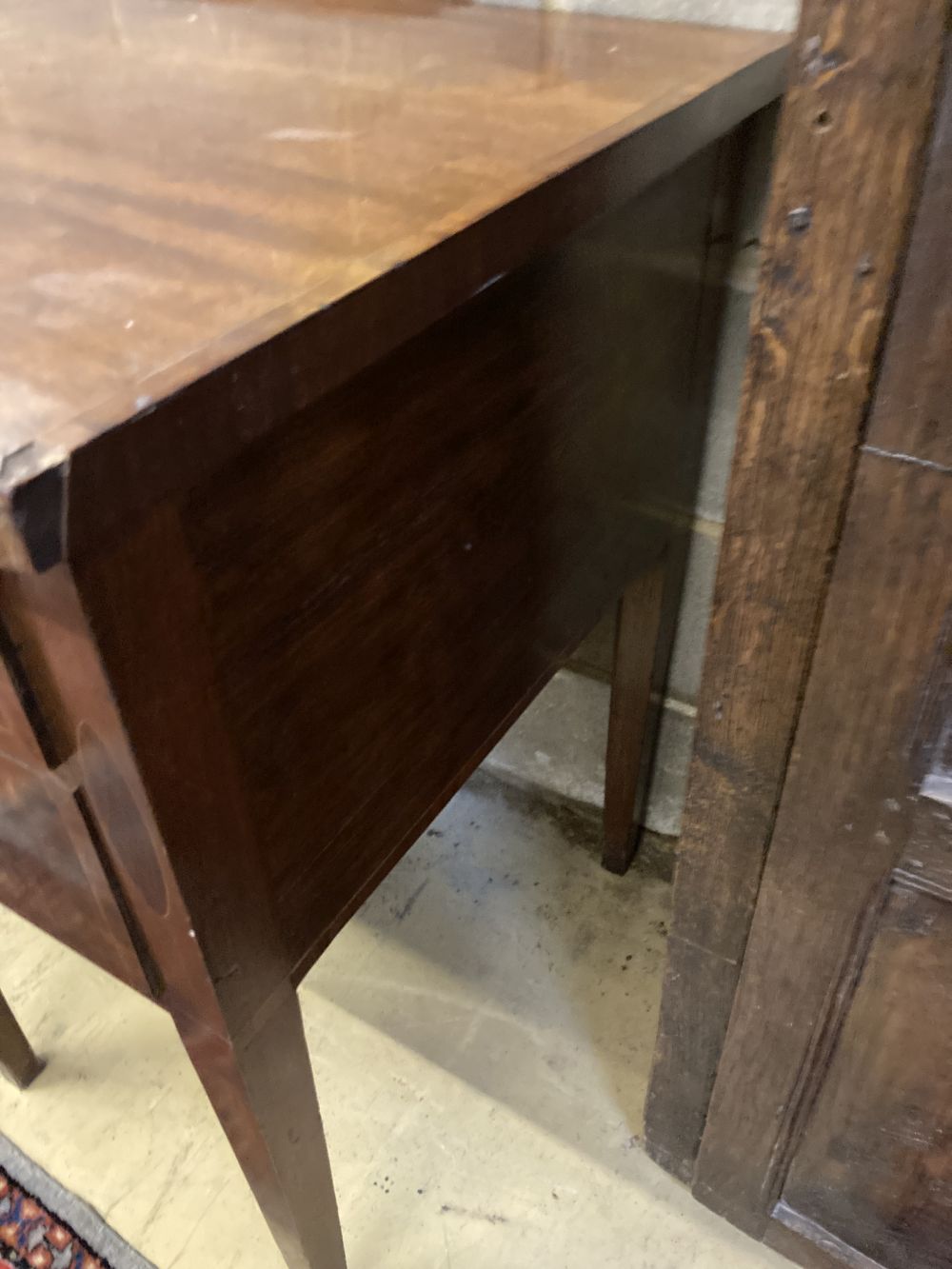 A George III mahogany crossbanded sideboard, width 153cm depth 64cm height 86cm